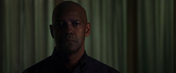 Movie still from “The Equalizer” (2014), directed by Antoine Fuqua – A man with a bald head is looking at the camera; Close Up shot, Low angle