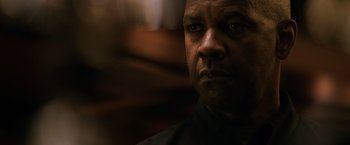 Movie still from “The Equalizer” (2014), directed by Antoine Fuqua – A man's face in the dark; Close Up shot, Over the shoulder angle