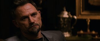 Movie still from “The Equalizer” (2014), directed by Antoine Fuqua – A person with a beard; Close Up shot, Over the shoulder angle