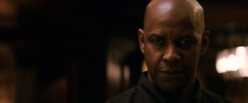 Movie still from “The Equalizer” (2014), directed by Antoine Fuqua – A man with a bald head is looking at the camera; Close Up shot, Low angle