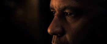 Movie still from “The Equalizer” (2014), directed by Antoine Fuqua – A man's face in the dark; Extreme Close Up shot, Low angle