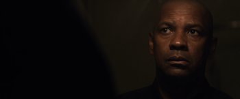 Movie still from “The Equalizer” (2014), directed by Antoine Fuqua – A person looking at the camera; Close Up shot, Over the shoulder angle