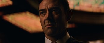 Movie still from “The Equalizer” (2014), directed by Antoine Fuqua – A person wearing a suit and tie; Close Up shot, Low angle