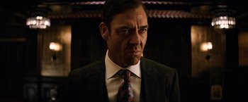 Movie still from “The Equalizer” (2014), directed by Antoine Fuqua – A person wearing a suit and tie; Close Up shot, Low angle