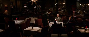 Movie still from “The Equalizer” (2014), directed by Antoine Fuqua – Two men sitting at a table in front of a waiter; Wide shot, Over the shoulder angle