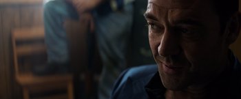 Movie still from “The Equalizer” (2014), directed by Antoine Fuqua – A man's face in a dark room; Close Up shot, Low angle