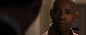 Movie still from “The Equalizer” (2014), directed by Antoine Fuqua – A man's face in front of a mirror; Close Up shot, Over the shoulder angle