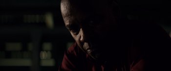Movie still from “The Equalizer” (2014), directed by Antoine Fuqua – A person in a dark room; Close Up shot, Low angle
