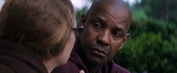 Movie still from “The Equalizer” (2014), directed by Antoine Fuqua – A man looking at a woman's face in the mirror; Close Up shot, Over the shoulder angle