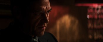 Movie still from “The Equalizer” (2014), directed by Antoine Fuqua – A man's face in a dark room; Close Up shot, Low angle