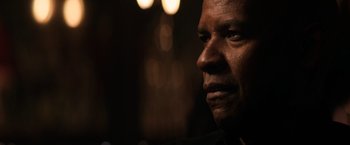 Movie still from “The Equalizer” (2014), directed by Antoine Fuqua – A man's face in the dark; Close Up shot, Over the shoulder angle
