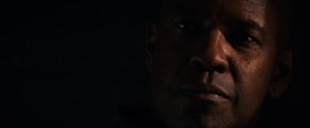 Movie still from “The Equalizer” (2014), directed by Antoine Fuqua – A man's face in the dark; Close Up shot, Low angle