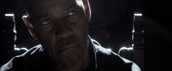 Movie still from “The Equalizer 3” (2023), directed by Antoine Fuqua – A person looking at the camera; Close Up shot, Over the shoulder angle
