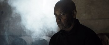 Movie still from “The Equalizer 3” (2023), directed by Antoine Fuqua – A man with a beard is looking into the distance; Close Up shot, Low angle