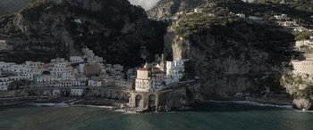 Movie still from “The Equalizer 3” (2023), directed by Antoine Fuqua – A view of a town on the side of a cliff; Extreme Wide shot, High angle