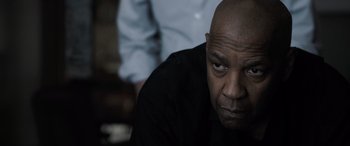 Movie still from “The Equalizer 3” (2023), directed by Antoine Fuqua – An older man with a bald head looking at the camera; Close Up shot, Over the shoulder angle