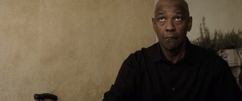 Movie still from “The Equalizer 3” (2023), directed by Antoine Fuqua – A person wearing a black shirt; Close Up shot, Low angle