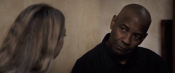 Movie still from “The Equalizer 3” (2023), directed by Antoine Fuqua – A man and a woman talking to each other; Close Up shot, Over the shoulder angle