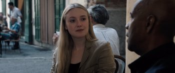 Movie still from “The Equalizer 3” (2023), directed by Antoine Fuqua – A woman sitting in front of a man in a chair; Close Up shot, Over the shoulder angle