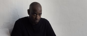 Movie still from “The Equalizer 3” (2023), directed by Antoine Fuqua – A man with a bald head is looking into the distance; Close Up shot, Low angle