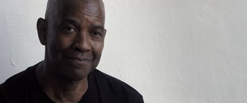 Movie still from “The Equalizer 3” (2023), directed by Antoine Fuqua – A person wearing a black t - shirt; Close Up shot, Low angle