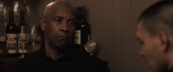 Movie still from “The Equalizer 3” (2023), directed by Antoine Fuqua – An older black man looking at the camera; Close Up shot, Low angle