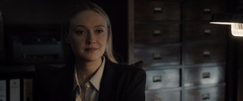 Movie still from “The Equalizer 3” (2023), directed by Antoine Fuqua – A woman in a black suit with a black cat; Close Up shot, Over the shoulder angle