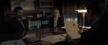 Movie still from “The Equalizer 3” (2023), directed by Antoine Fuqua – A woman sitting at a table in front of a man; Medium shot, Over the shoulder angle