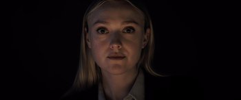 Movie still from “The Equalizer 3” (2023), directed by Antoine Fuqua – A woman with blonde hair and a white dress shirt; Close Up shot, Low angle