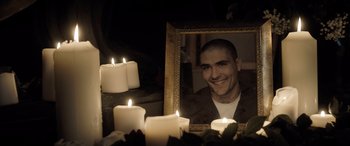 Movie still from “The Equalizer 3” (2023), directed by Antoine Fuqua – A picture of a man in front of some candles; Close Up shot, High angle