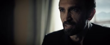 Movie still from “The Equalizer 3” (2023), directed by Antoine Fuqua – A person with a beard; Close Up shot, Over the shoulder angle