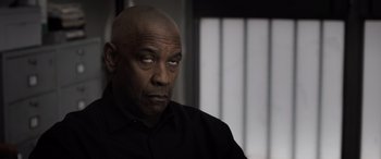 Movie still from “The Equalizer 3” (2023), directed by Antoine Fuqua – An older man with a bald head looking at the camera; Close Up shot, Low angle