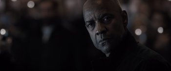 Movie still from “The Equalizer 3” (2023), directed by Antoine Fuqua – A man with a bald head is looking at the camera; Close Up shot, Low angle