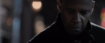 Movie still from “The Equalizer 3” (2023), directed by Antoine Fuqua – A man's face in the dark; Close Up shot, Low angle