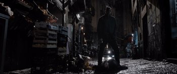 Movie still from “The Equalizer 3” (2023), directed by Antoine Fuqua – A man standing in the middle of a street; Wide shot, Low angle