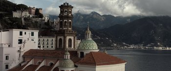 Movie still from “The Equalizer 3” (2023), directed by Antoine Fuqua – A view of a church with a steeple in the background; Extreme Wide shot, Low angle