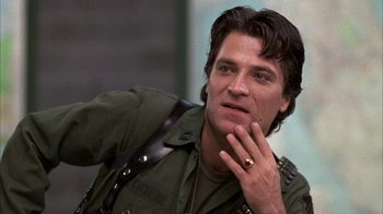 Movie still from “Day of the Dead” (1985), directed by George A. Romero – A person with a hand on his chin; Close Up shot, Low angle