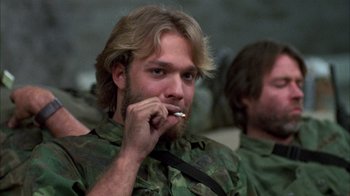 Movie still from “Day of the Dead” (1985), directed by George A. Romero – A person smoking a cigarette; Close Up shot, Low angle