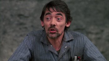 Movie still from “Day of the Dead” (1985), directed by George A. Romero – A person with a pen in his mouth; Close Up shot, Low angle