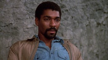 Movie still from “Day of the Dead” (1985), directed by George A. Romero – A person wearing a shirt and jacket; Close Up shot, Low angle