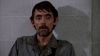 Movie still from “Day of the Dead” (1985), directed by George A. Romero – A person with a beard; Close Up shot, Low angle