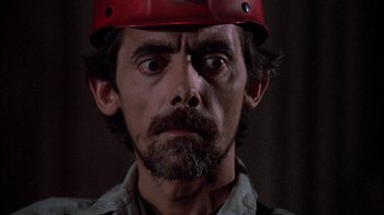 Movie still from “Day of the Dead” (1985), directed by George A. Romero – A person wearing a hard hat; Close Up shot, Low angle