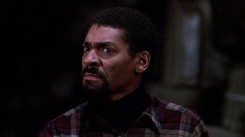 Movie still from “Day of the Dead” (1985), directed by George A. Romero – A person with a beard; Close Up shot, Low angle