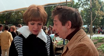 Movie still from “The Exorcist” (1973), directed by William Friedkin – A man and a woman talking to each other outside; Medium shot, Over the shoulder angle