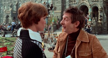 Movie still from “The Exorcist” (1973), directed by William Friedkin – A man and a woman talking to each other outside; Medium shot, Over the shoulder angle