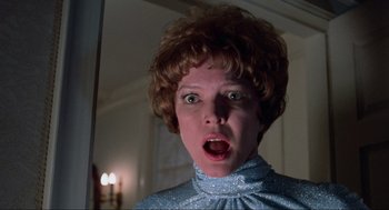 Movie still from “The Exorcist” (1973), directed by William Friedkin – A person with a surprised look on their face; Close Up shot, Low angle