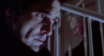 Movie still from “The Exorcist” (1973), directed by William Friedkin – A person looking at a mirror; Close Up shot, Low angle