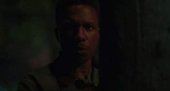 Movie still from “The Exorcist: Believer” (2023), directed by David Gordon Green – A person in a dark room; Close Up shot, Low angle