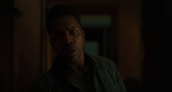 Movie still from “The Exorcist: Believer” (2023), directed by David Gordon Green – A person wearing a shirt; Close Up shot, Low angle