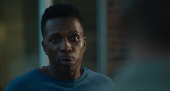 Movie still from “The Exorcist: Believer” (2023), directed by David Gordon Green – A person wearing a blue and red shirt; Close Up shot, Over the shoulder angle